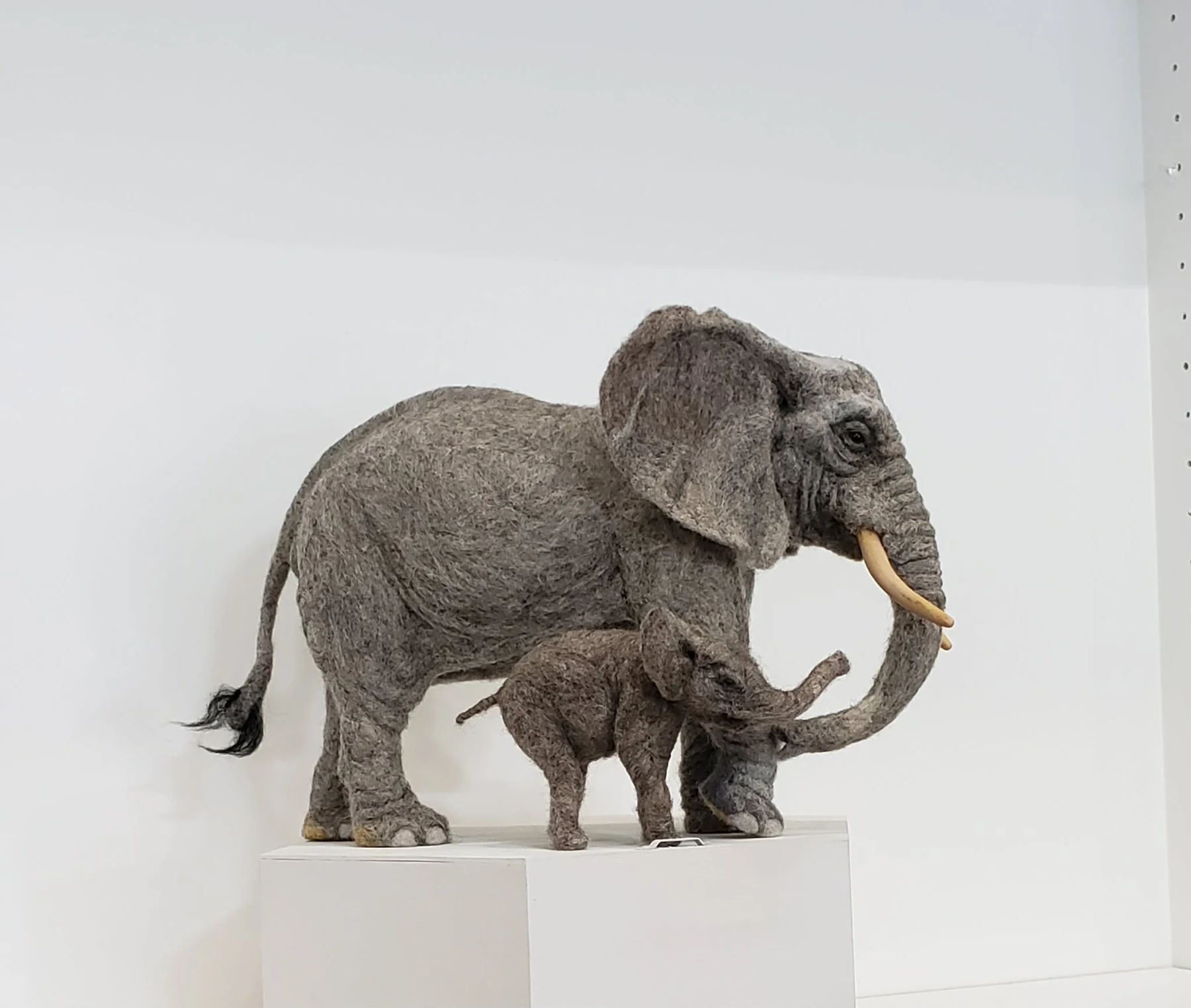 Needle-felted adult elephant and calf sculpture by Irina Hughes