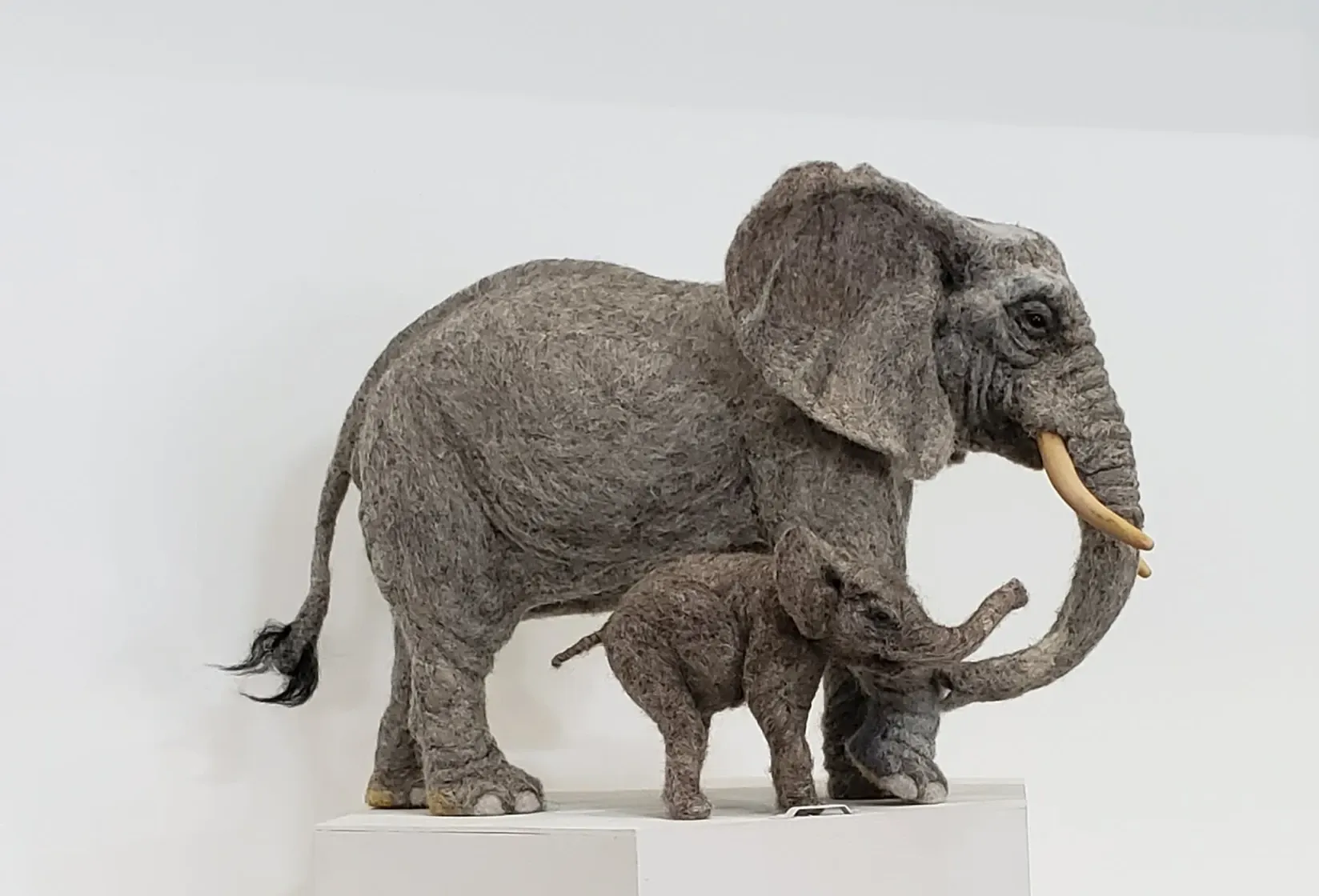 Needle-felted adult elephant and calf sculpture by Irina Hughes