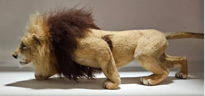 Work in progress: needle-felted lion with a full mane and low stance by Irina Hughes