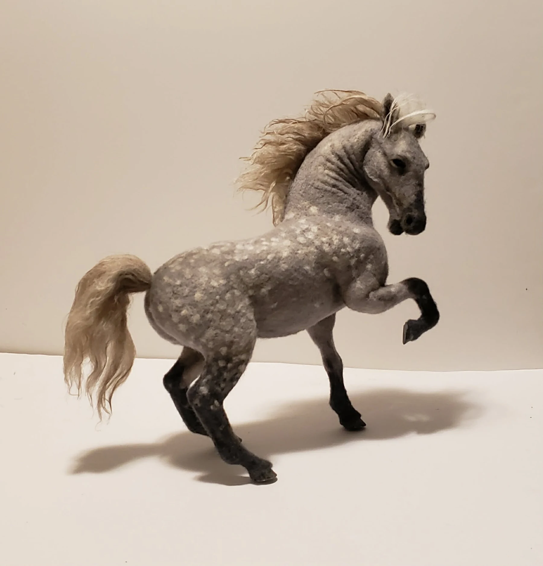 Needle-felted dapple gray rearing horse sculpture by Irina Hughes